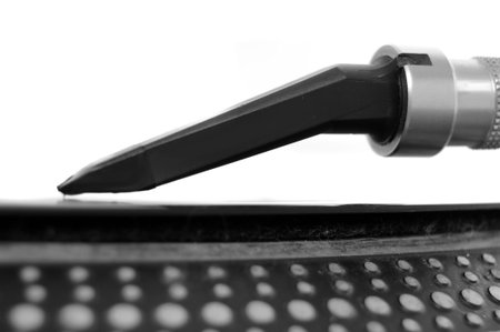 DJ record turntable. Macro side view closeup of the needle on a 12 inch vinyl LP playing hiphop...