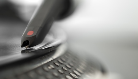 DJ record turntable. Macro closeup of the needle on a 12 inch vinyl LP playing hiphop techno rave beats.の写真素材