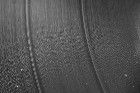 A macro closeup of an LP record with dust in the groovesの写真素材