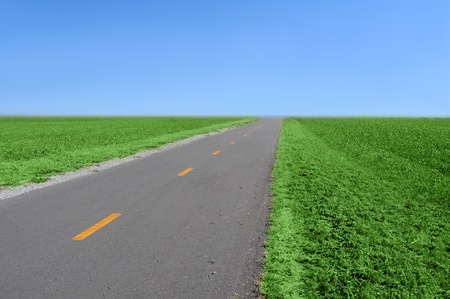 A narrow bike path that looks just like a asphalt streetの写真素材