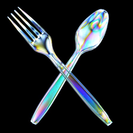 Photoelasticity birefringence shows stressed plastic of a fork and spoon cross polarizedの写真素材