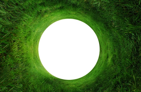 Abstract background of green grass going around in a circle with a white copyspace in the middle. Could make a hole in one golf background.の写真素材