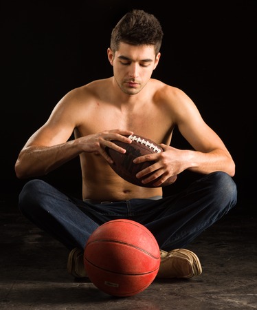 College Student Holding Footballの写真素材