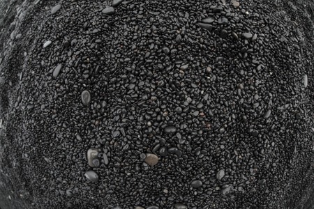Volcanic rock on black sand beach at Vik in southern Icelandの写真素材