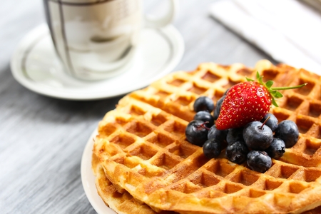 Warm Waffle Breakfast with blueberries  made in a home kitchenの写真素材