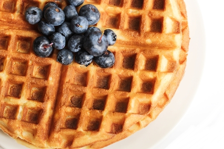 Warm Waffle Breakfast with blueberries  made in a home kitchenの写真素材