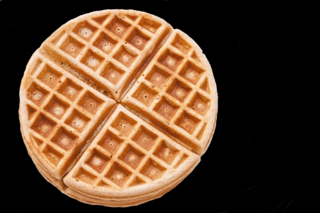 Warm Waffle Breakfast made in a home kitchen isolated in blackの写真素材