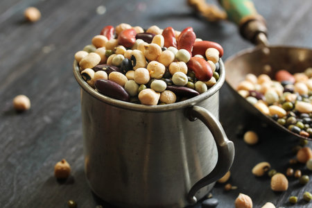 Soup mix / mixed Legumes - soup ingredients in a metal cup on dark moody background, selective focus