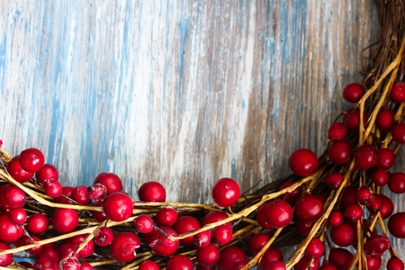Red Berries on blue wooden background with copy space, selective focusの写真素材