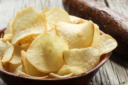 Tapioca chips / Yucca Chips with Yucca on side- Popular deep fried Kerala snack with Tapiyoca,selective focusの写真素材