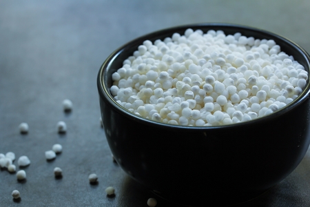 Still life of Tapioca Pearls / Sabudhana in a black bowl, selective focusの写真素材