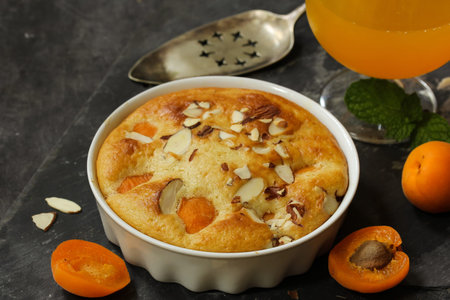 Apricot pudding cake / Summer fruit cake with fresh Apricots, selective focusの写真素材