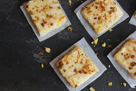 Kalakand - Popular Indian sweet made od soldified milk and Paneer topped with nutsの写真素材