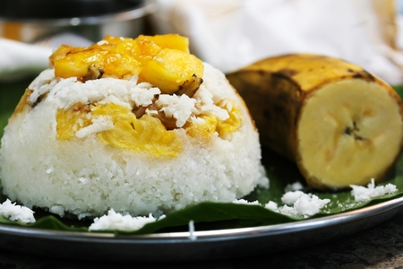 Kerala Ethakka Puttu / Steamed rice coconut cake with ripe plantains, selective focusの写真素材