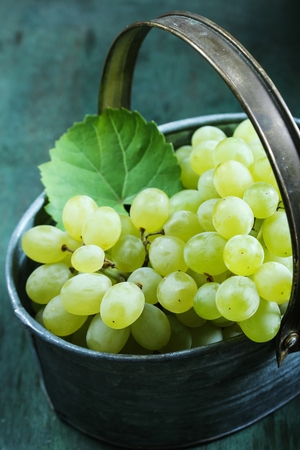 White Table grapes on rustic vintage basket still life, selective focusの写真素材