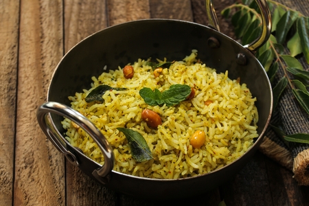 South Indian Curry leaves rice / Karuvepilai sadam served in a Kadaiの写真素材
