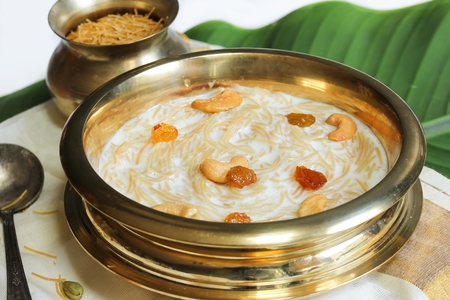 Close up of Semiya Kheer served in Traditional Brass vessel, selective focusの写真素材