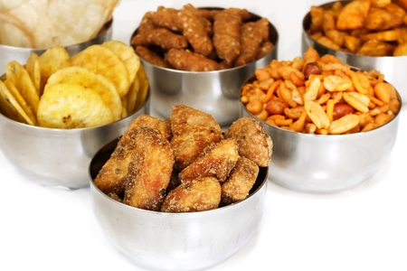 Variety of Indian snacks isolated on whiteの写真素材