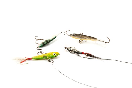 Four Fishing baits on a white backgroundの写真素材