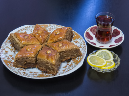 Baku Baklava with Tea in a glass of the form -Armud- with lemon.の写真素材