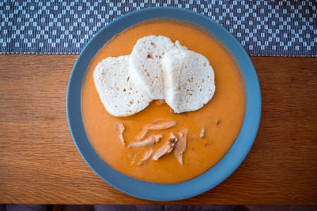 Traditional chicken hen on paprika or paprica creamy sauce with bread dumlings, typical czech foodの写真素材