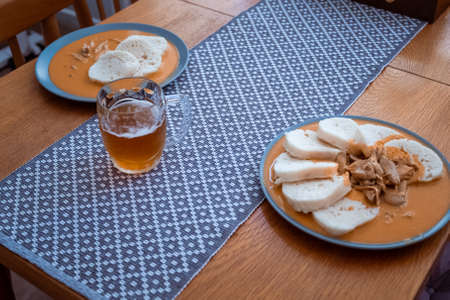 Traditional chicken hen on paprika or paprica creamy sauce with bread dumlings, typical czech foodの写真素材