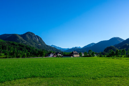 Panoramic view of beautiful mountain landscape, green Austrian village in the Alps, Mountains surrounding the Austrian villageの写真素材