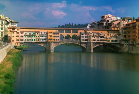 A view of the Old Bridge Ponte Vecchio over Arno river in Florence, Italyの写真素材