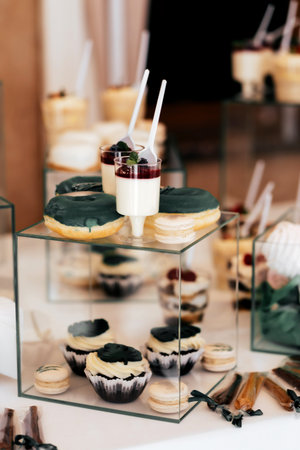 Sponge cake with matcha and raspberry filling topped with sour cream. Square cake with fresh berries.の写真素材