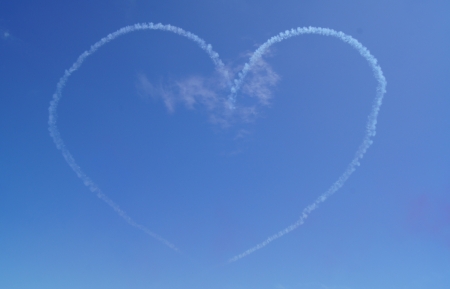 Heart made of cloud against a blue skyの写真素材