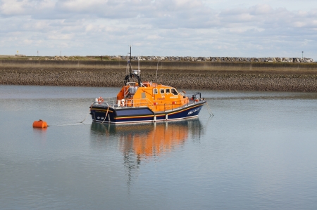 RNLI Lifeboat moored in Eastbourne harbour ready for emergency call outのeditorial素材