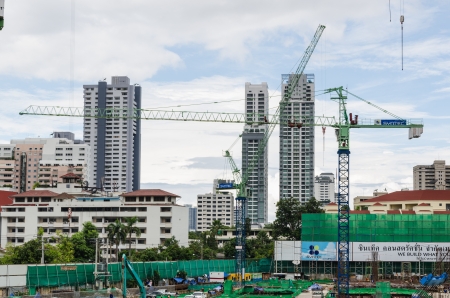BANGKOK - OCTOBER 8 : Construction site with multiple cranes at Sukhumvit road on October 8, 2012 in Bangkok, Thailand.のeditorial素材