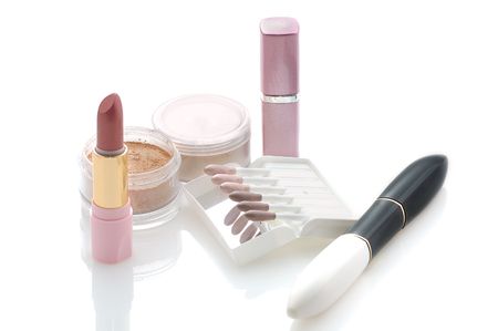 makeup set with  lipsticks, powder, sticks of eye shadowsの写真素材