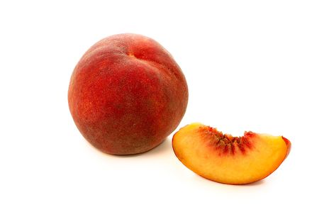 peach with slice isolated on white backgroundの写真素材