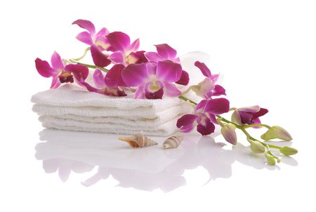 white towels,pink orchid, seashells on whiteの写真素材