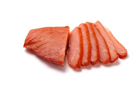  cut smoked pork fillet isolated on white backgroundの写真素材
