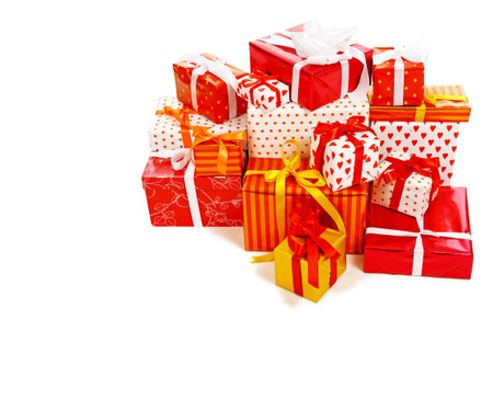stack of festive gift boxes decorated with satin bow isolated on white background