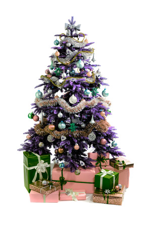 decorated Christmas tree with gifts isolated on white backgroundの写真素材