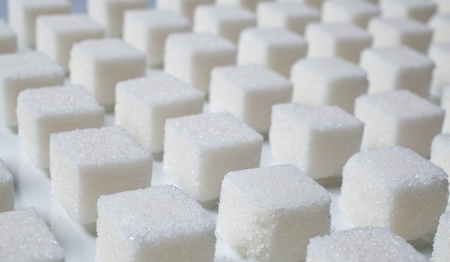 pile of sugar cubes  on whtie backgroundの写真素材