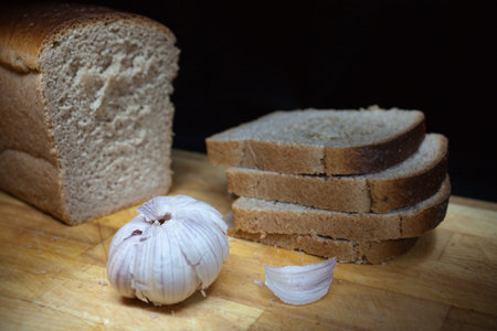 Assorted composition of breads on table with black background