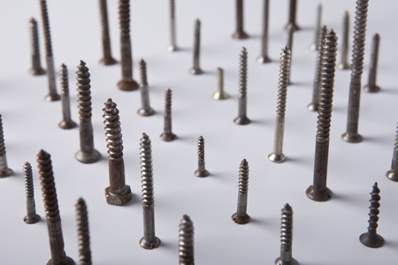 an assortment of bolts, screws, nuts isolated on whiteの写真素材