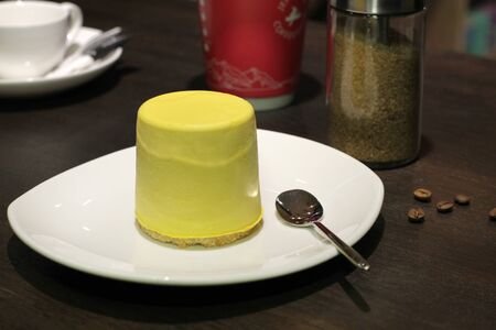 Cup of coffe with cake and beansの写真素材