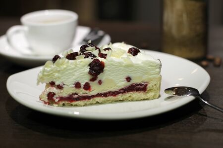 Cup of coffe with cake and beansの写真素材