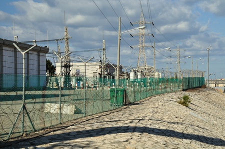 Power station enclosed with barbed wire fence の写真素材