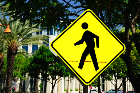Traffic sign warning about pedestrian crossing. USA.の写真素材