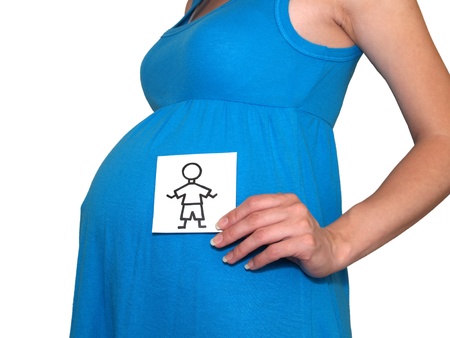 The pregnant woman holds drawing of the boy  の写真素材