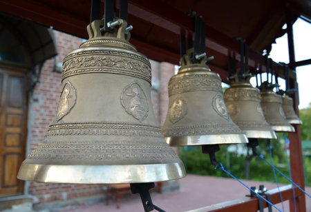 Church bells on a figurative folding belfry