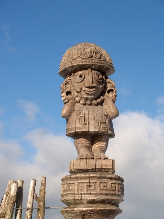 Wooden idol against the blue skyの写真素材