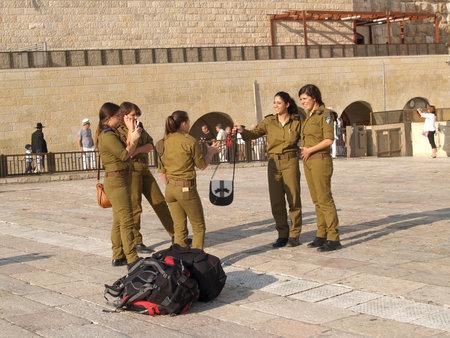 Female military personnel of the Israeli army on the square in front of the Wailing Wall. Jerusalem, Israelのeditorial素材
