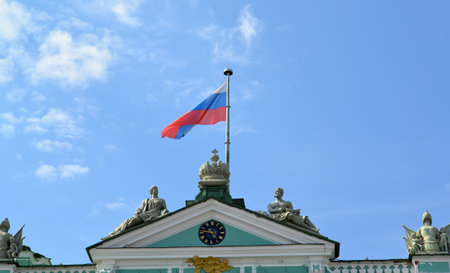 ST. PETERSBURG, RUSSIA - JULY 09, 2014: The Russian flag flutters over the Winter Palaceのeditorial素材